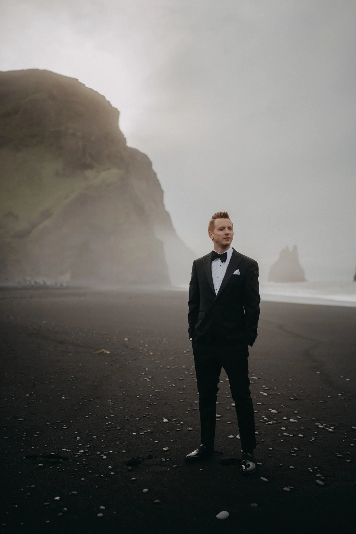Eric Lucky standing on Reynisfjara Black Sand Beach in Iceland