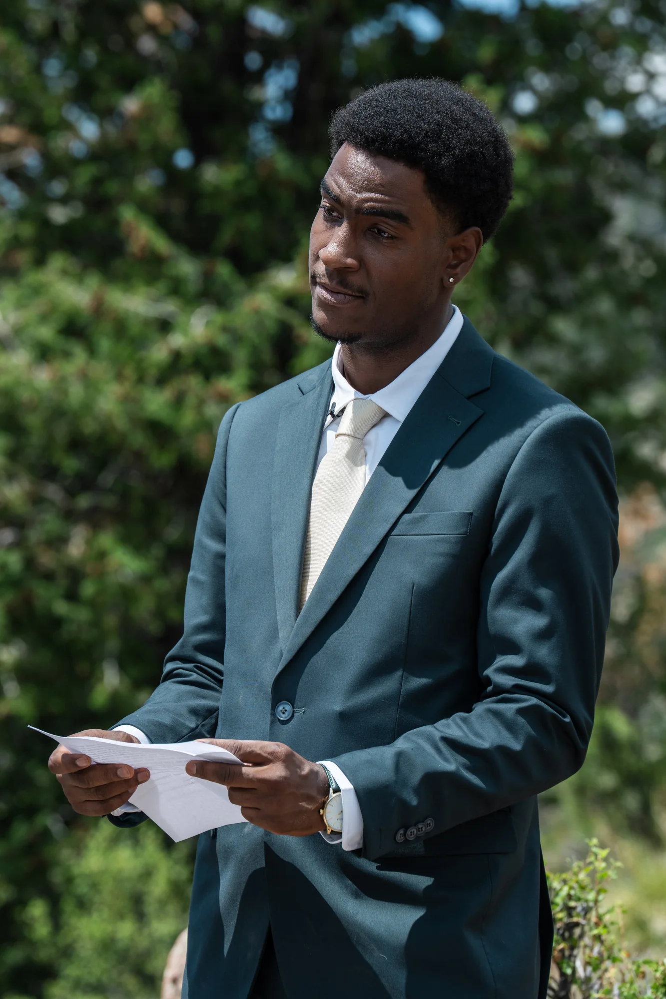 Groom reading his vows during a Colorado mountain elopement ceremony